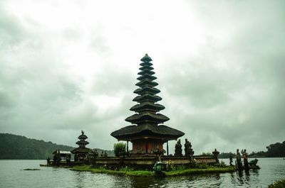 View of temple against cloudy sky