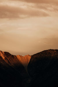 Scenic view of mountains against sky during sunset