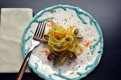 Dish of spaghetti with seafood and pistachios typical sicilian cuisine