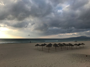 Scenic view of beach against sky during sunset