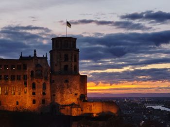 Historic building against sky during sunset