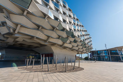 View of office building against blue sky