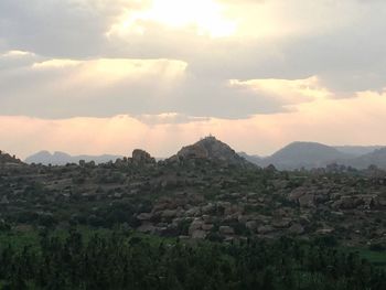 Scenic view of mountains against sky at sunset