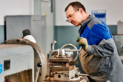 Young man working in workshop