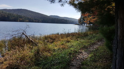 Scenic view of lake in front of mountains