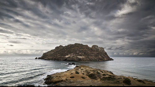 Scenic view of sea against dramatic sky