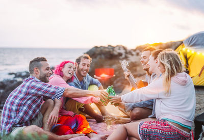 Cheerful people enjoying on the beach 