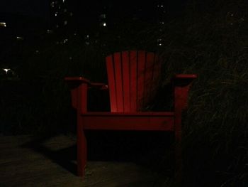 Empty bench at night