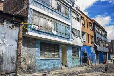 Messy street by residential buildings