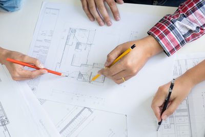 High angle view of man working on table