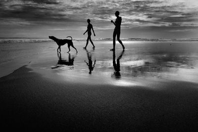 Woman standing on shore