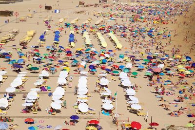 High angle view of people enjoying at beach