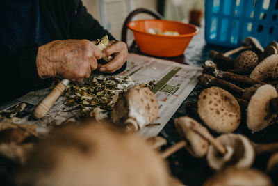 High angle view of man preparing food on table