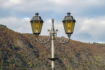 Low angle view of street light against sky