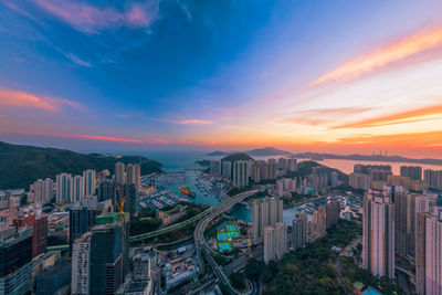 High angle view of city at sunset