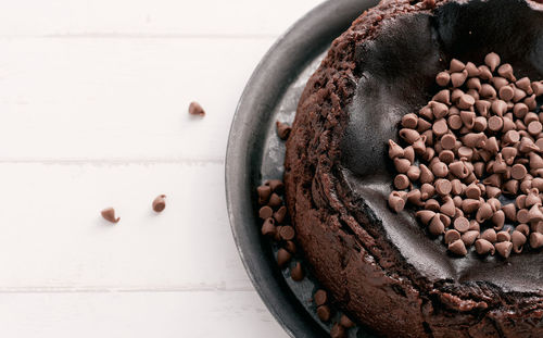 Overhead view of a chocolate basque burnt cheesecake with chocolate chips