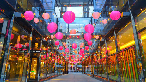 Illuminated lanterns hanging in city at night