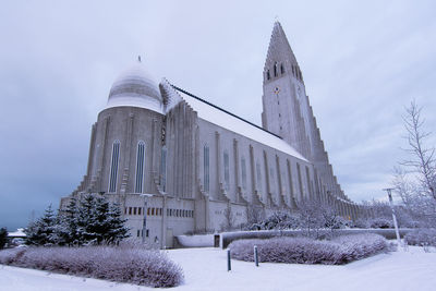 Traditional building against sky during winter