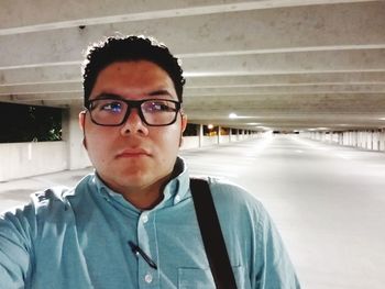 Portrait of young man wearing eyeglasses