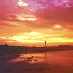 Scenic view of dramatic sky at sunset