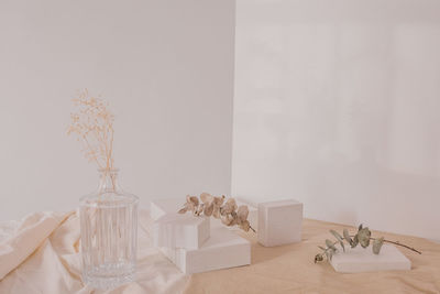 White flower vase on table at home