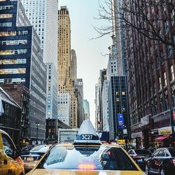 Cars on street in modern city