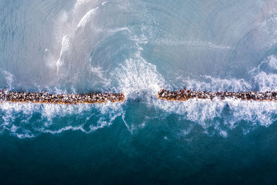 Water splashing in sea with rockes