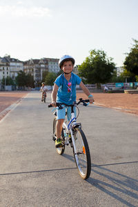 Man riding bicycle on road