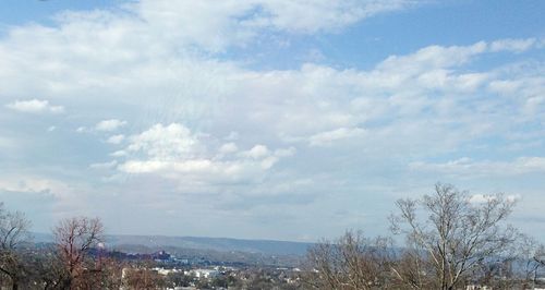 Scenic view of landscape against cloudy sky