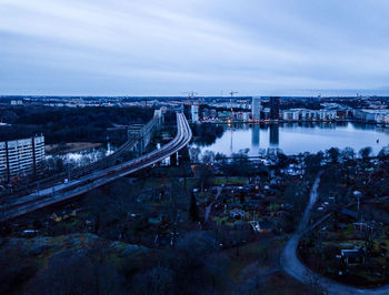 High angle view of bridge over river against cloudy sky