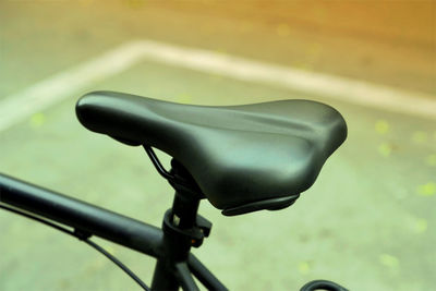 Close-up of bicycle on road