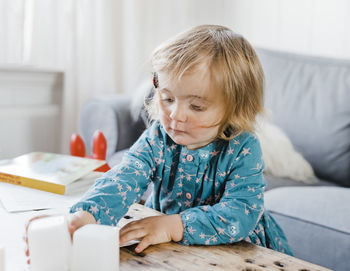 Cute girl sitting at home