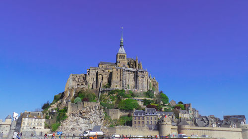 Low angle view of building against blue sky