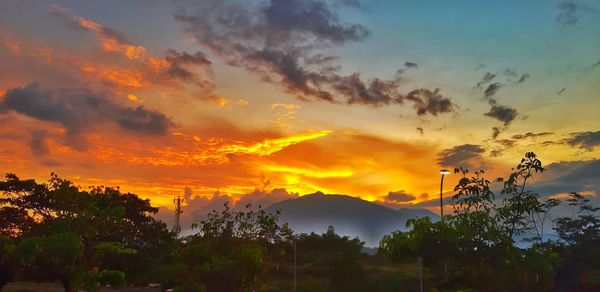 Scenic view of dramatic sky during sunset