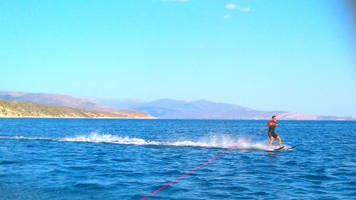 People surfing in sea