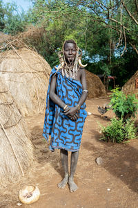 Portrait of a smiling girl standing outdoors