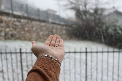 Midsection of person against railing