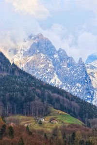 Scenic view of snowcapped mountains against sky