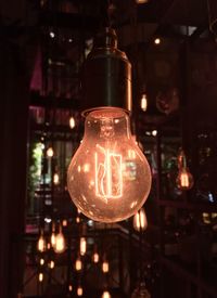 Close-up of illuminated light bulb