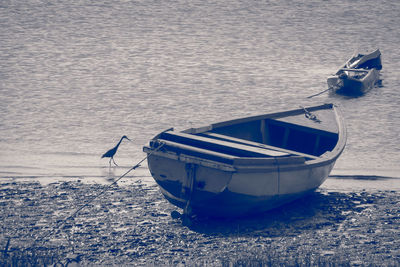 Boats moored on shore