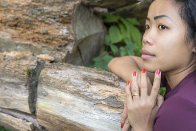 Close-up portrait of young woman looking away