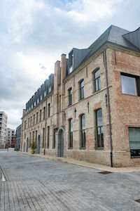 Buildings in city against sky