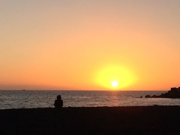 Scenic view of sea at sunset