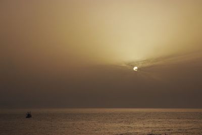 Scenic view of sea against clear sky during sunset