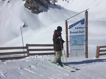 Man working on snow covered landscape