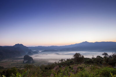 Scenic view of mountains against sky during sunset