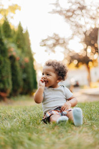 Full length of cute baby girl on field