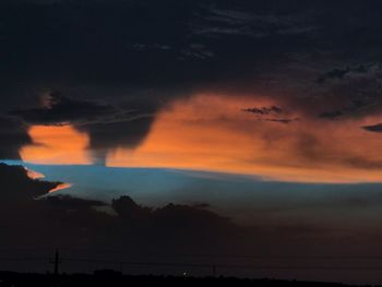 Low angle view of dramatic sky during sunset