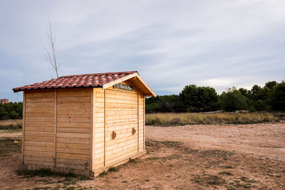 House on field against sky