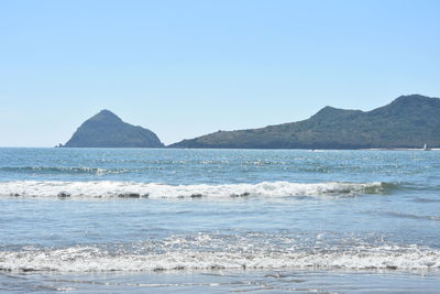 Scenic view of sea against clear blue sky